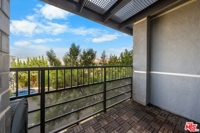a view of a balcony with an outdoor space