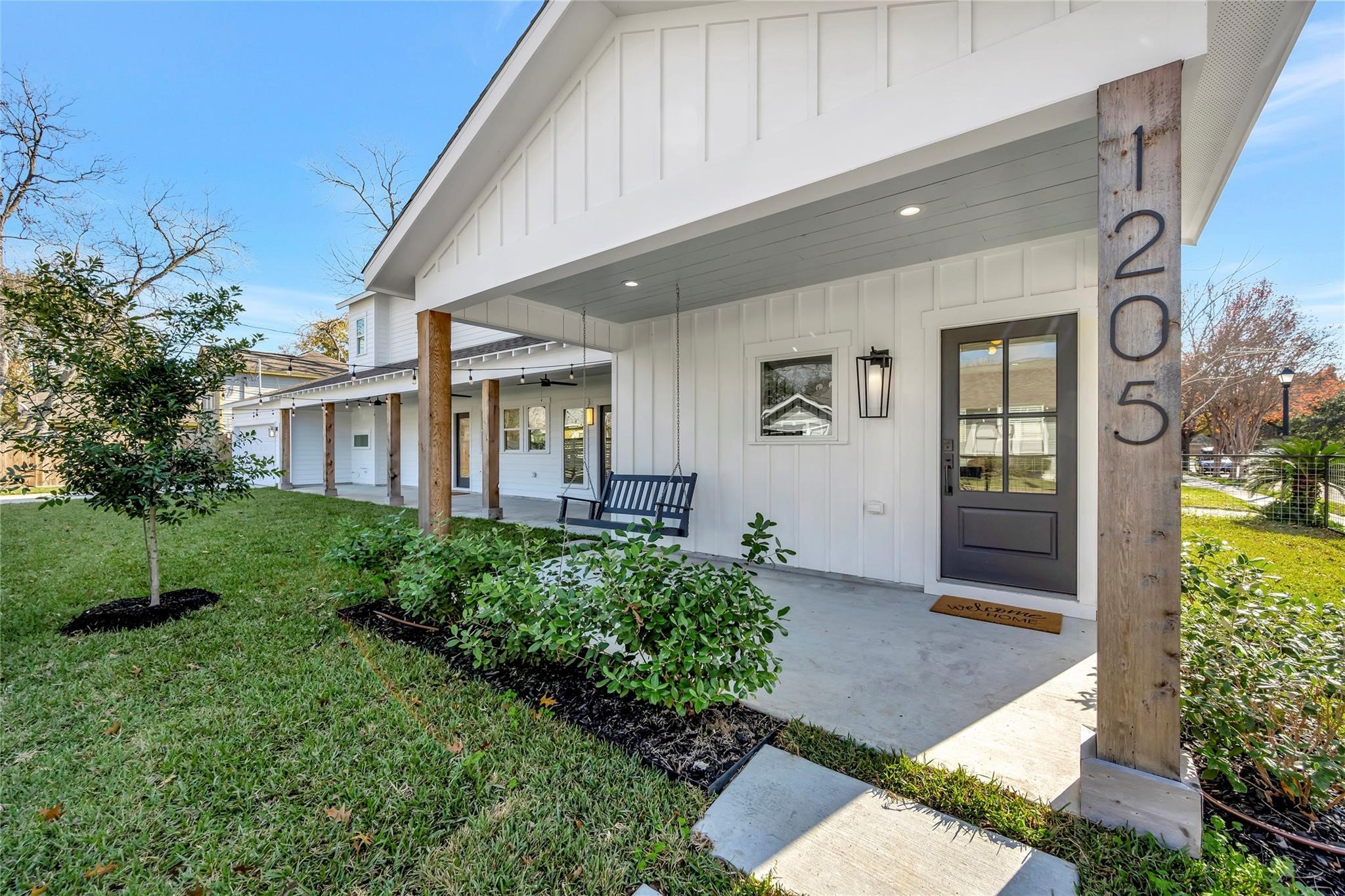 1205 Temple Street Houston, TX 77009 - Photo 3 of 33 Designed to embrace both beauty and livability, the expansive front porch and thoughtfully landscaped grounds create an inviting transition from the vibrant Heights neighborhood to the comfort of home.