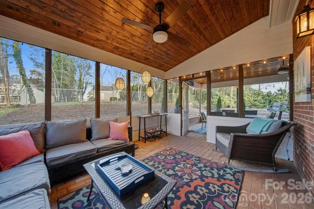 a outdoor living space with furniture and a rug
