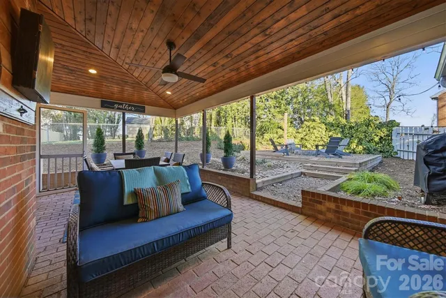 a dining room with furniture wooden floor and a potted plant