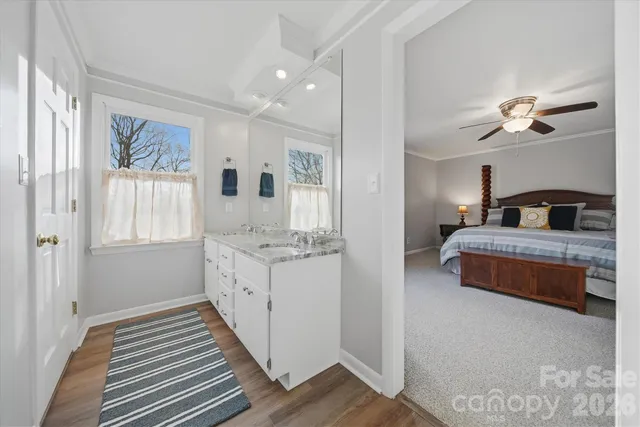 a white toilet sitting next to a shower