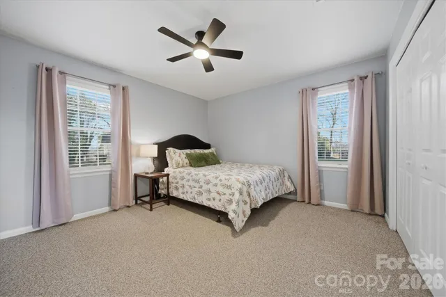 a bedroom with a bed and a tv