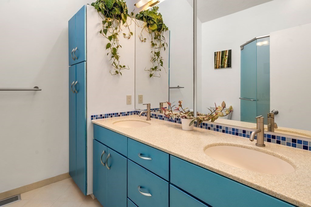 24 Flintlock Road Lexington, MA 02420 - Photo 17 of 33 a bathroom with a granite countertop sink and a mirror