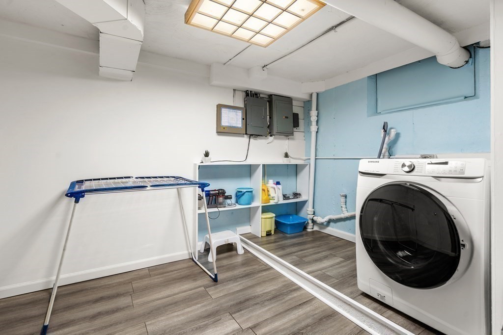 24 Flintlock Road Lexington, MA 02420 - Photo 25 of 33 a view of a kitchen with washing machine and racks