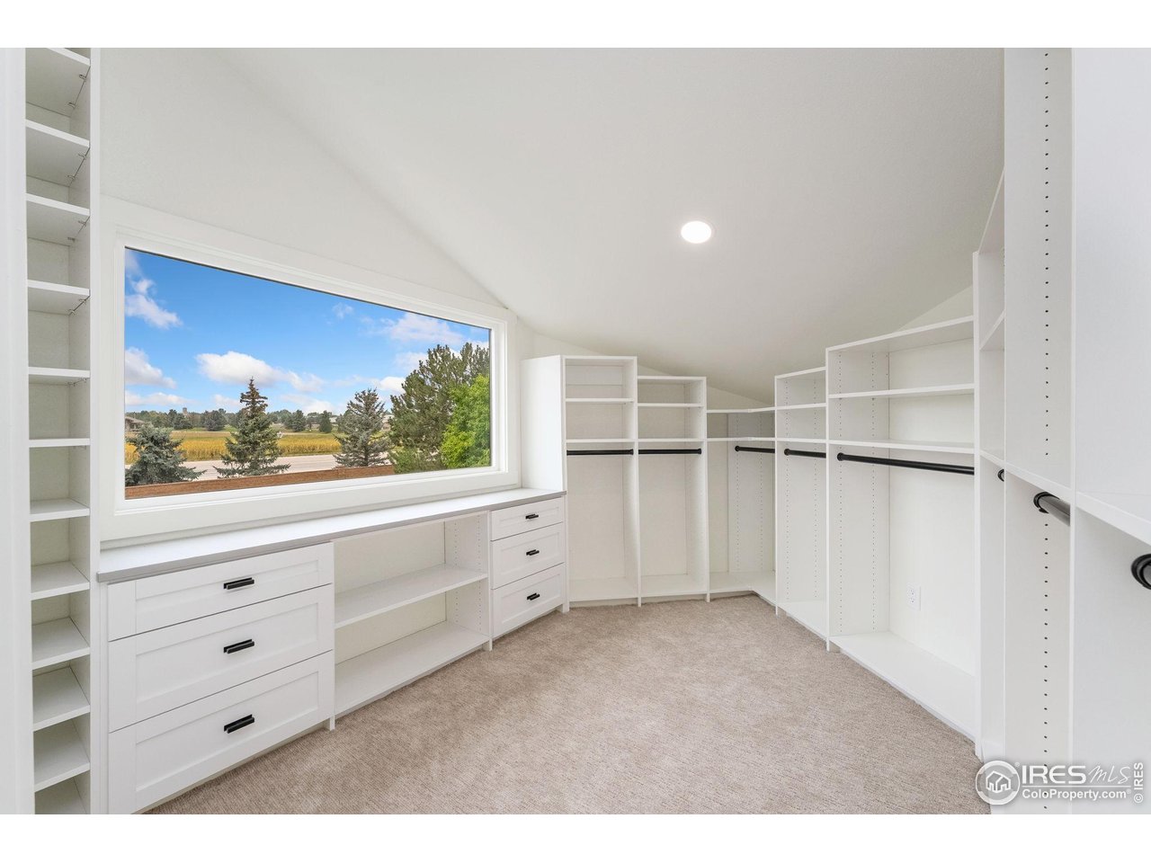 5304 Vardon Way Fort Collins, CO 80528 - Photo 27 of 47 a view of room with cabinet and windows