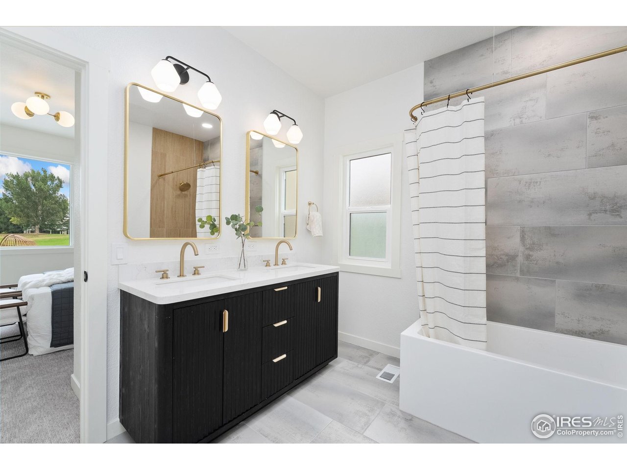 5304 Vardon Way Fort Collins, CO 80528 - Photo 31 of 47 a bathroom with a sink double vanity mirror and a bathtub