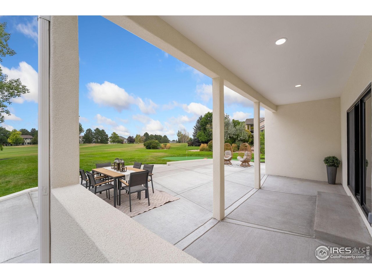 5304 Vardon Way Fort Collins, CO 80528 - Photo 42 of 47 a view of a patio with a table and chairs