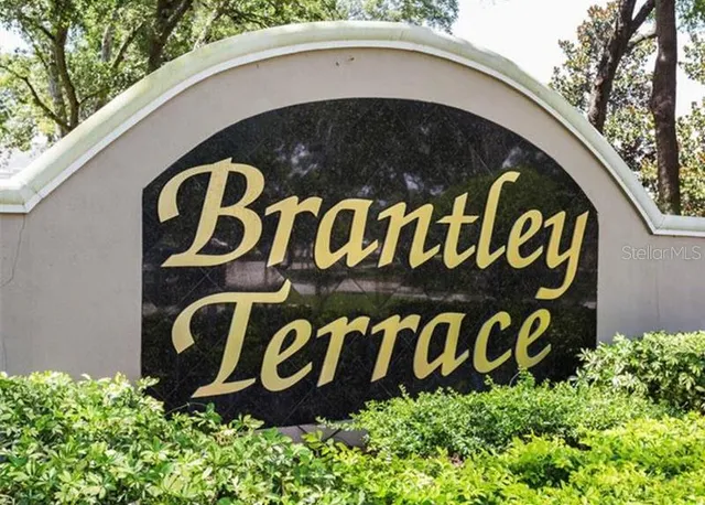 a view of sign board with a white building