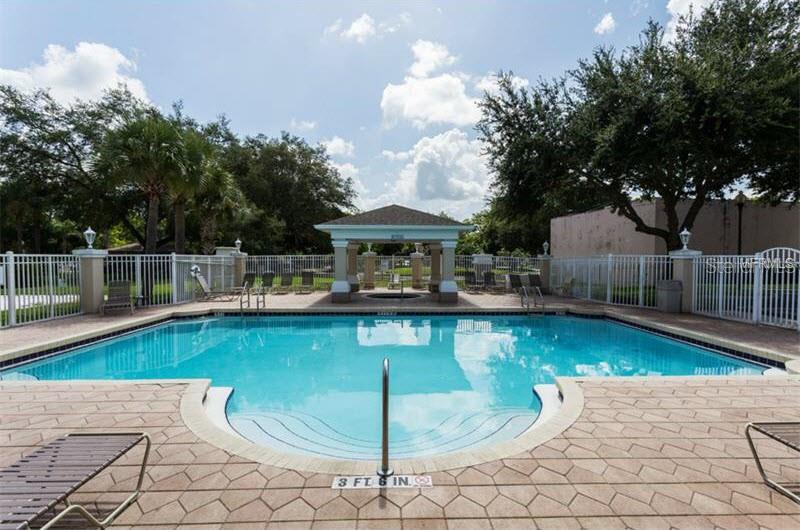 588 Brantley Terrace Way, Unit 305 Altamonte Springs, FL 32714 - Photo 13 of 13 a view of a swimming pool with a patio