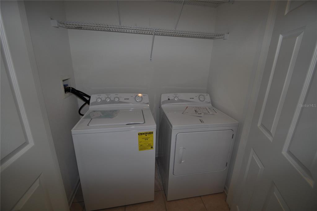 588 Brantley Terrace Way, Unit 305 Altamonte Springs, FL 32714 - Photo 9 of 13 a utility room with dryer and washer