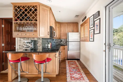 a bedroom with a large bed and a large window
