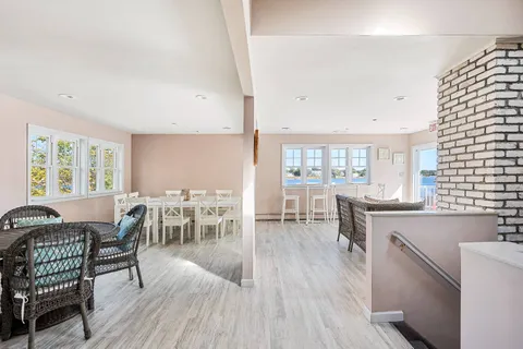 a dining room with furniture and window