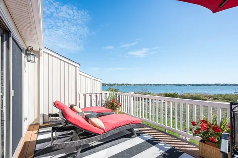 a living room with fireplace furniture and a flat screen tv