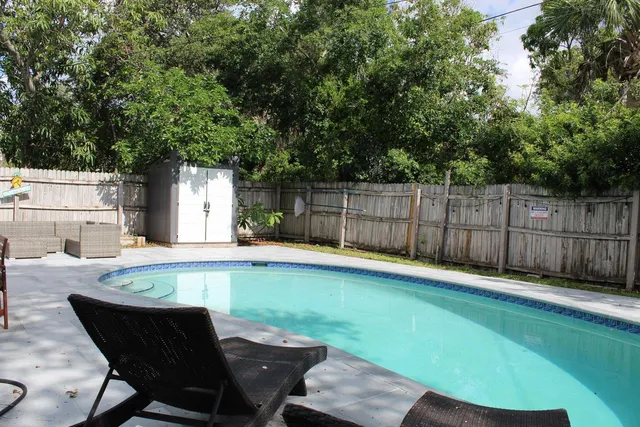 a view of a backyard with a sitting area