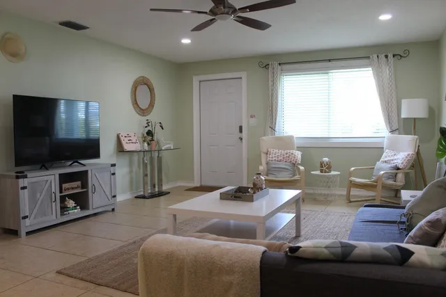 a living room with furniture and a flat screen tv
