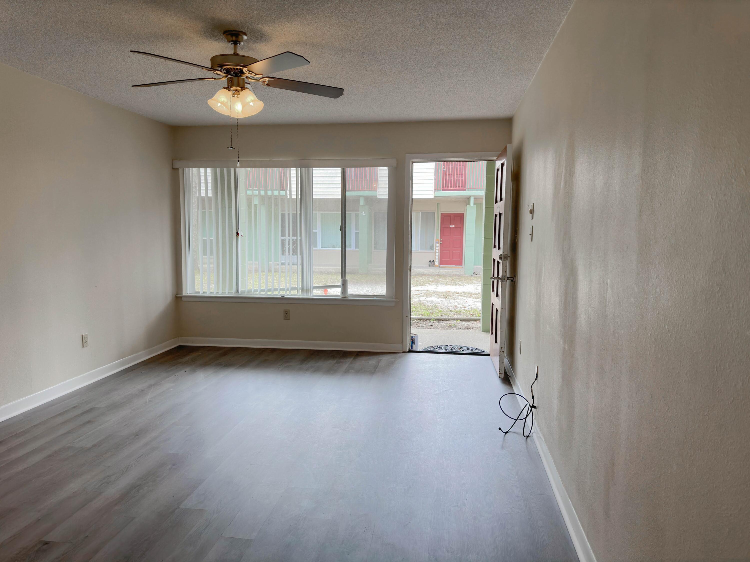 210 Pelham Road, Unit 103B Fort Walton Beach, FL 32547 - Photo 5 of 19 a view of an empty room with a window