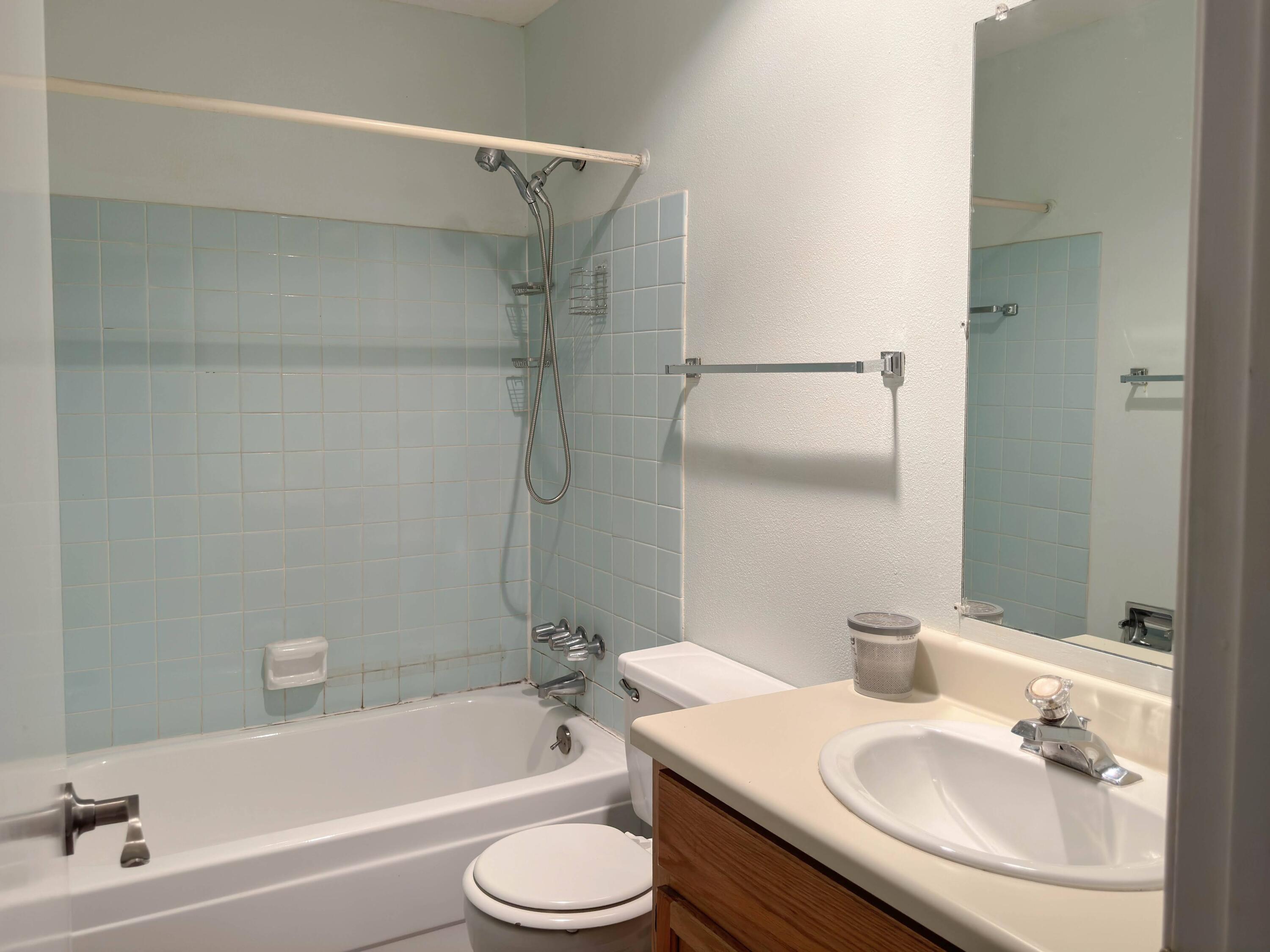 210 Pelham Road, Unit 103B Fort Walton Beach, FL 32547 - Photo 10 of 19 a bathroom with a sink toilet and shower