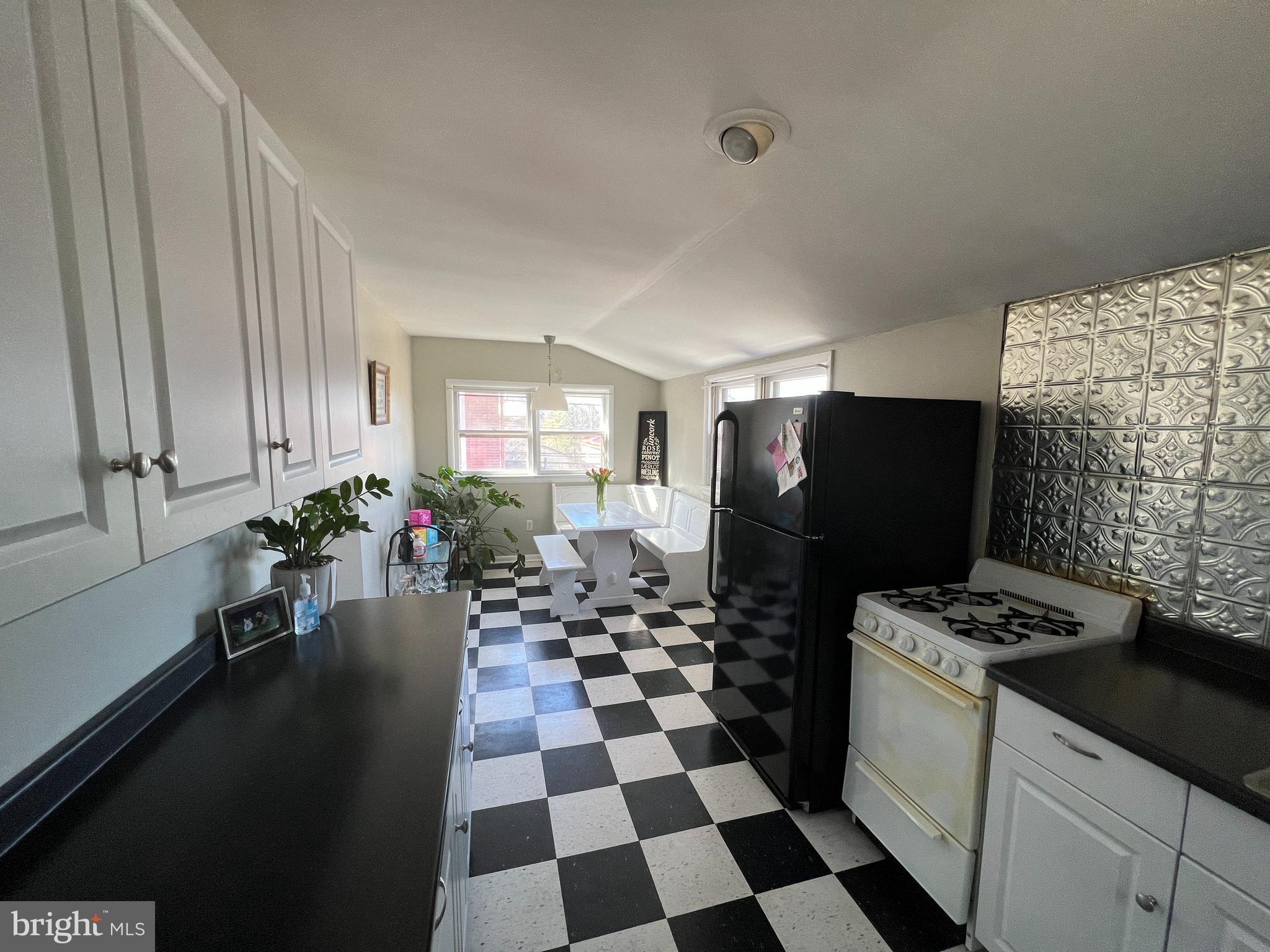 337 West Union Street, Unit 5 West Chester, PA 19382 - Photo 6 of 9 a kitchen with a sink a refrigerator and cabinets
