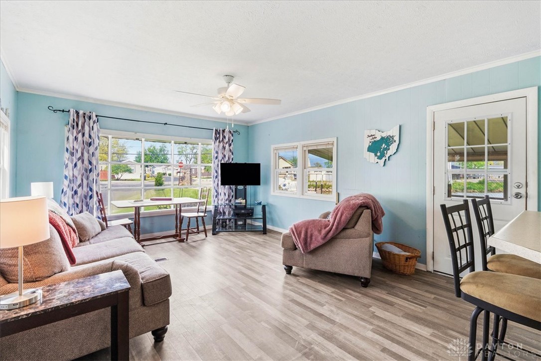 246 North Orchard Island Road Russells Point, OH 43348 - Photo 10 of 43 This bright living space features durable flooring and multiple windows, creating an inviting atmosphere.