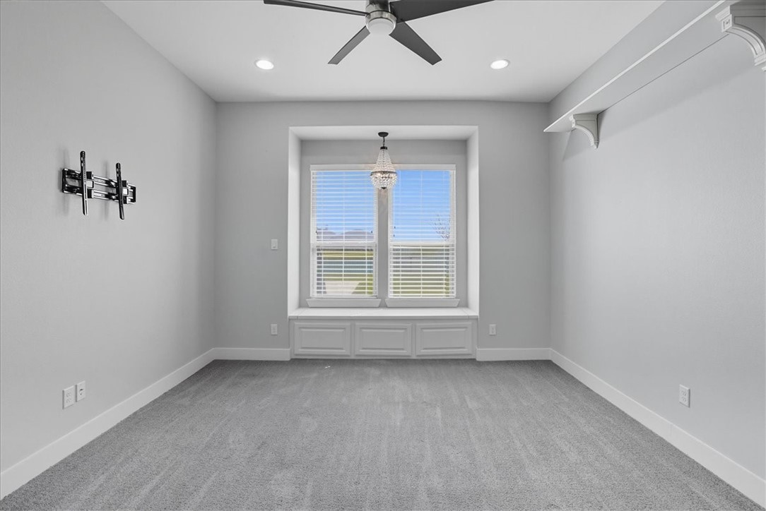 8658 KIng Ranch Drive Corpus Christi, TX 78414 - Photo 16 of 40 an empty room with a window and a ceiling fan