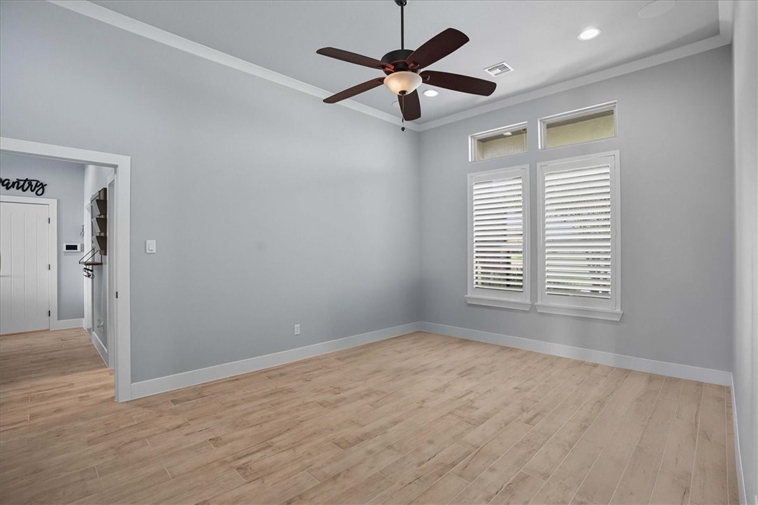 8658 KIng Ranch Drive Corpus Christi, TX 78414 - Photo 20 of 40 wooden floor in an empty room with a window