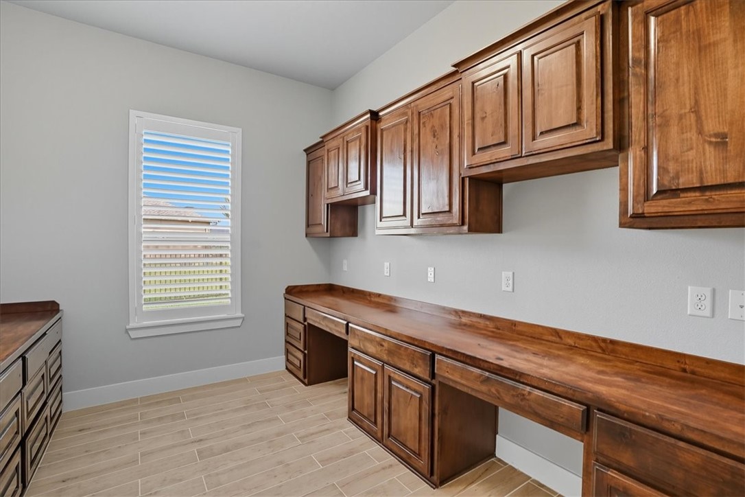 8658 KIng Ranch Drive Corpus Christi, TX 78414 - Photo 24 of 40 a kitchen with stainless steel appliances granite countertop a sink stove and cabinets