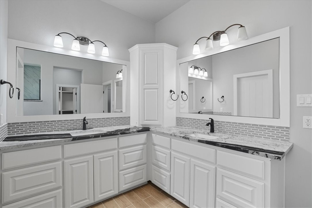 8658 KIng Ranch Drive Corpus Christi, TX 78414 - Photo 27 of 40 a bathroom with a granite countertop sink double and mirror