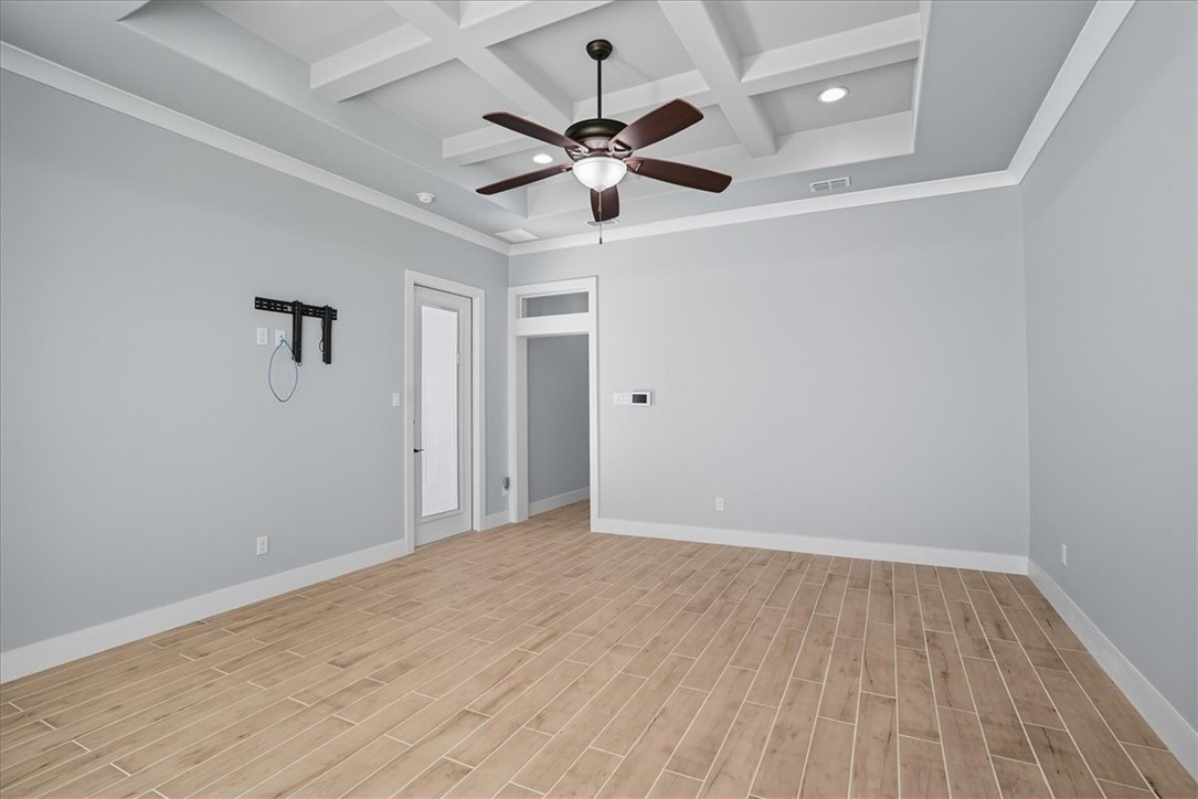 8658 KIng Ranch Drive Corpus Christi, TX 78414 - Photo 33 of 40 wooden floor in an empty room with a window