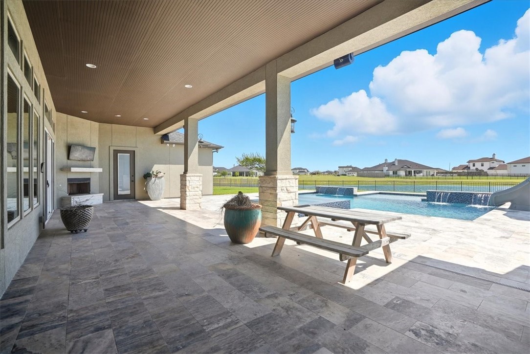8658 KIng Ranch Drive Corpus Christi, TX 78414 - Photo 34 of 40 a view of swimming pool with outdoor seating and a yard