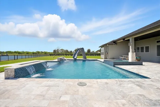 a view of swimming pool with a yard