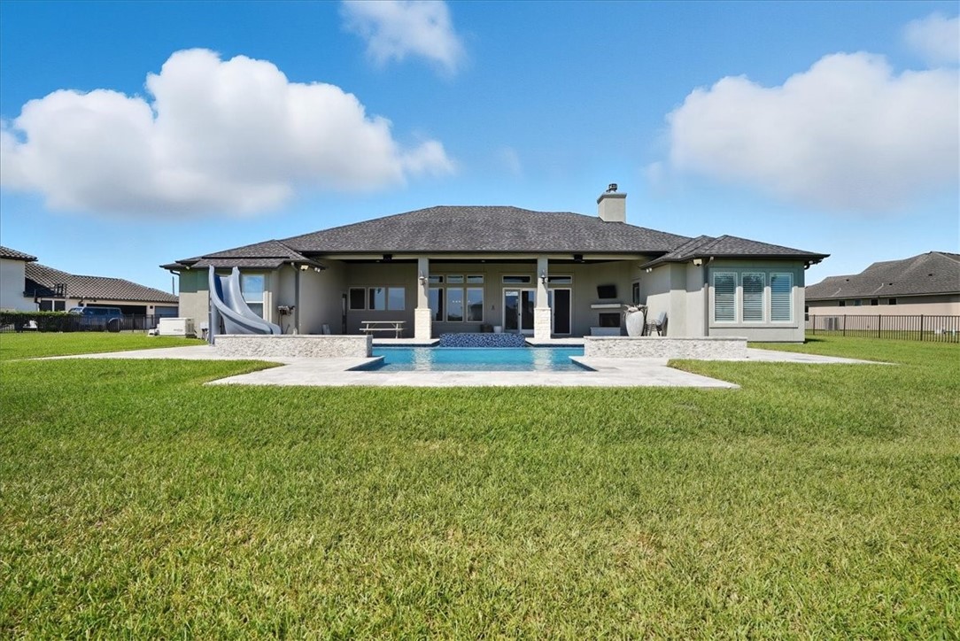 8658 KIng Ranch Drive Corpus Christi, TX 78414 - Photo 37 of 40 a front view of a house with swimming pool yard and patio