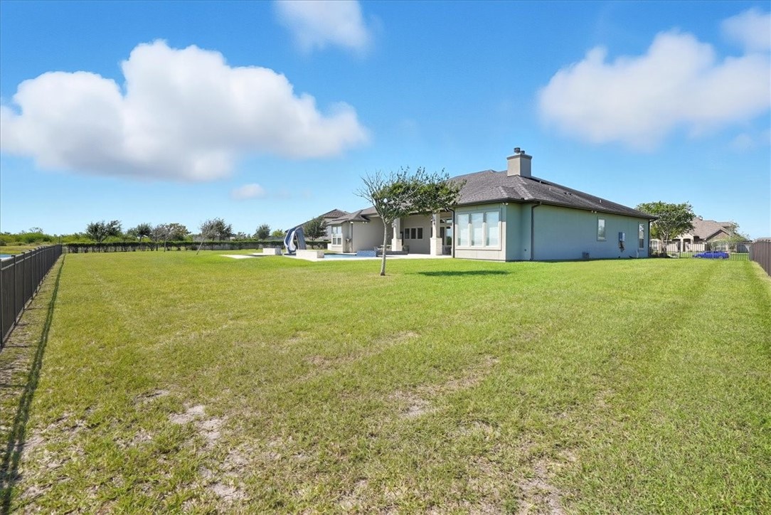 8658 KIng Ranch Drive Corpus Christi, TX 78414 - Photo 38 of 40 a view of a large body of water with a building in the background