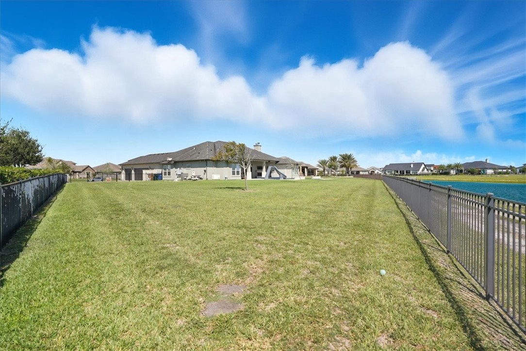 8658 KIng Ranch Drive Corpus Christi, TX 78414 - Photo 39 of 40 a view of a swimming pool and an outdoor seating