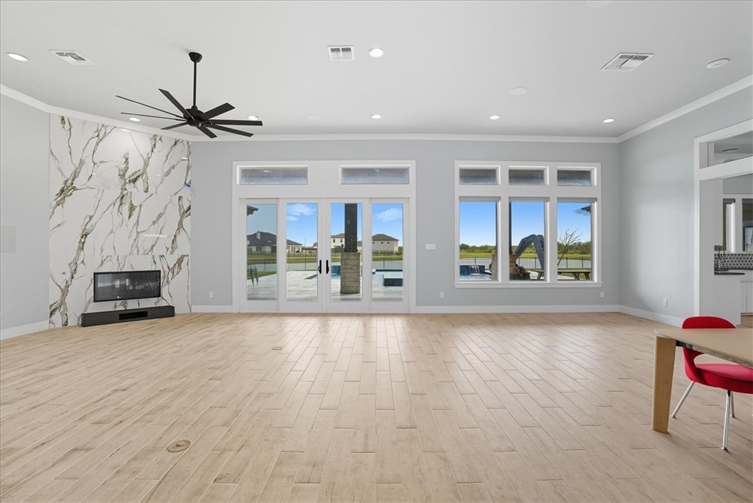 8658 KIng Ranch Drive Corpus Christi, TX 78414 - Photo 7 of 40 a view of an empty room with a window and kitchen view