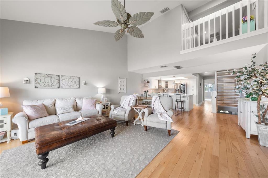 2515 Bay Boulevard, Unit B Indian Rocks Beach, FL 33785 - Photo 11 of 66 a living room with furniture and a table