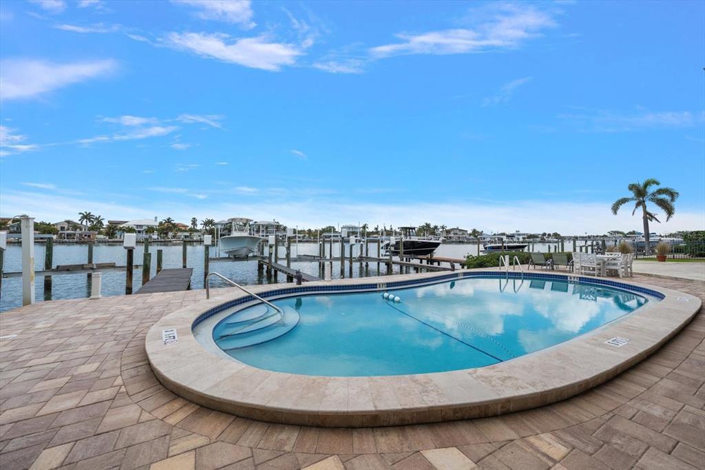 2515 Bay Boulevard, Unit B Indian Rocks Beach, FL 33785 - Photo 17 of 66 a view of a swimming pool with a terrace