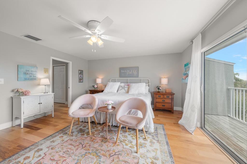 2515 Bay Boulevard, Unit B Indian Rocks Beach, FL 33785 - Photo 32 of 66 a bed room with a bed and a chandelier