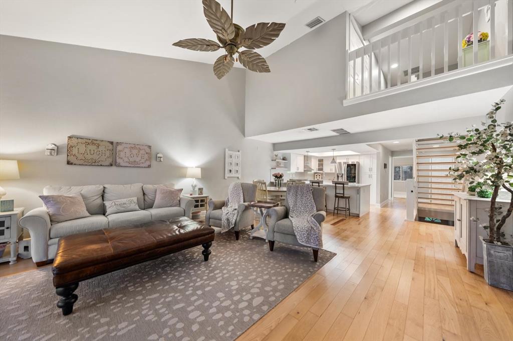 2515 Bay Boulevard, Unit B Indian Rocks Beach, FL 33785 - Photo 39 of 66 a living room with furniture and a wooden floor