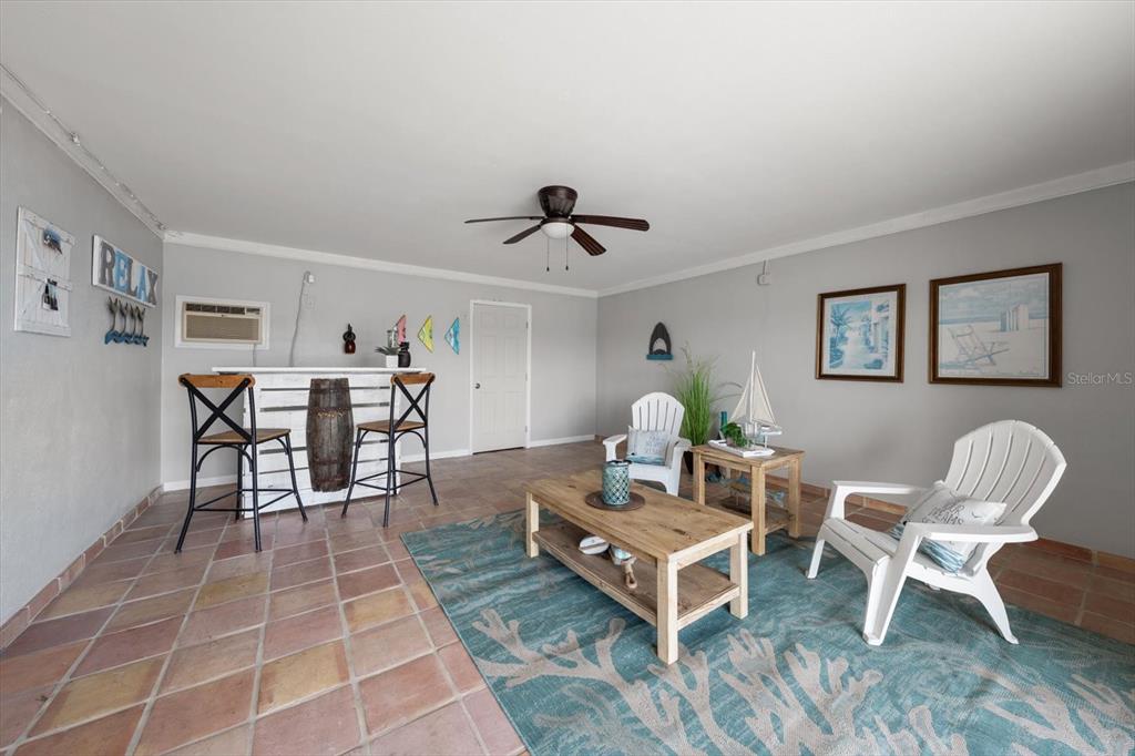 2515 Bay Boulevard, Unit B Indian Rocks Beach, FL 33785 - Photo 41 of 66 a living room with furniture and a table