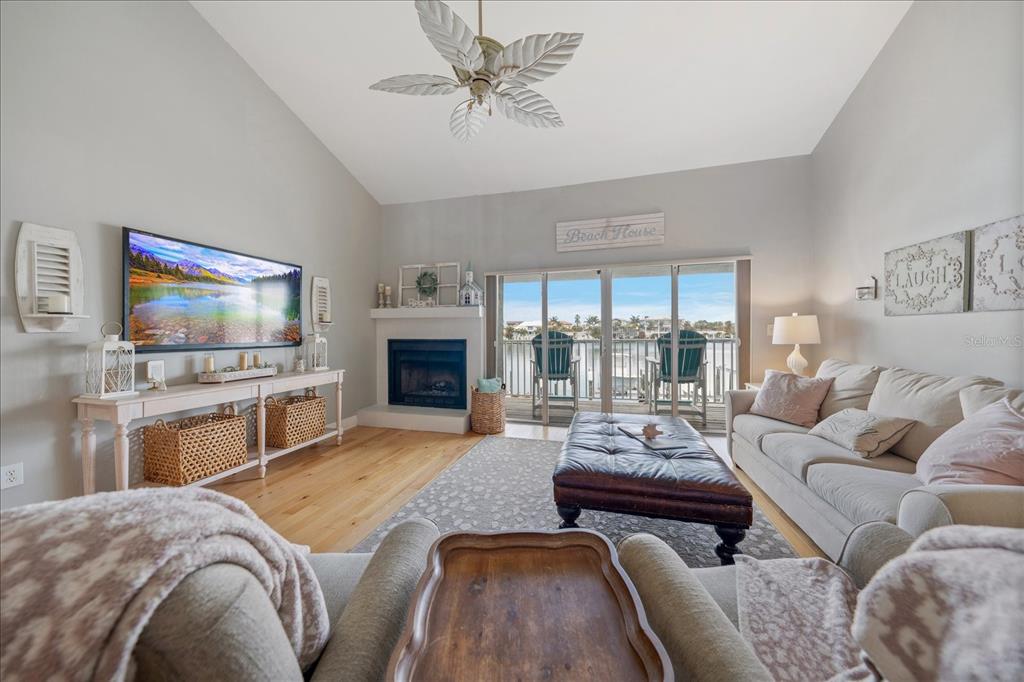 2515 Bay Boulevard, Unit B Indian Rocks Beach, FL 33785 - Photo 8 of 66 a living room with furniture fireplace and flat screen tv
