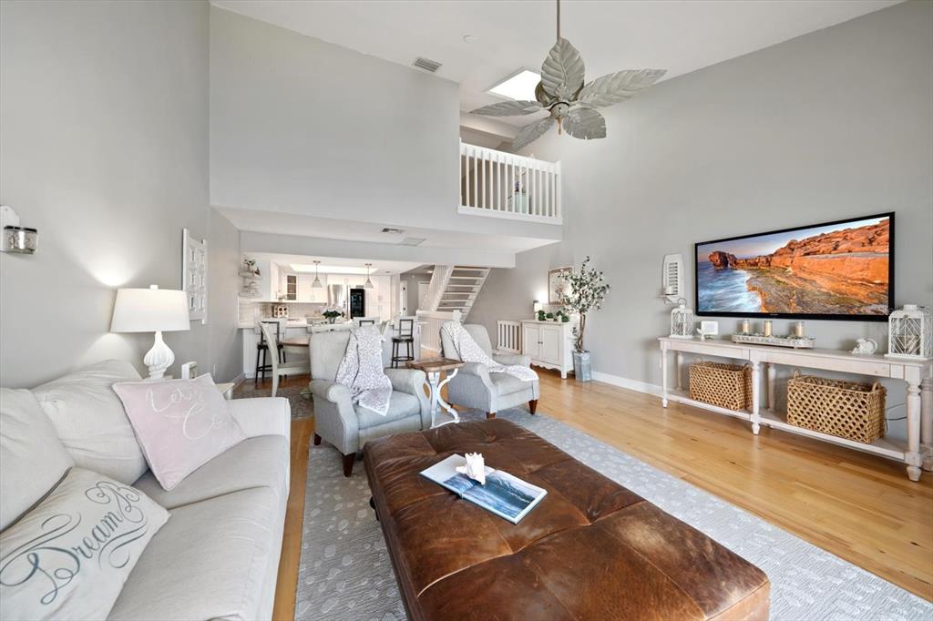 2515 Bay Boulevard, Unit B Indian Rocks Beach, FL 33785 - Photo 9 of 66 a living room with furniture and a flat screen tv