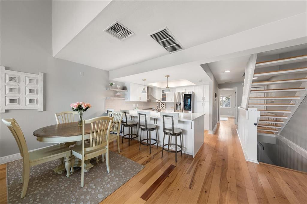 2515 Bay Boulevard, Unit B Indian Rocks Beach, FL 33785 - Photo 10 of 66 a dining room with furniture and wooden floor
