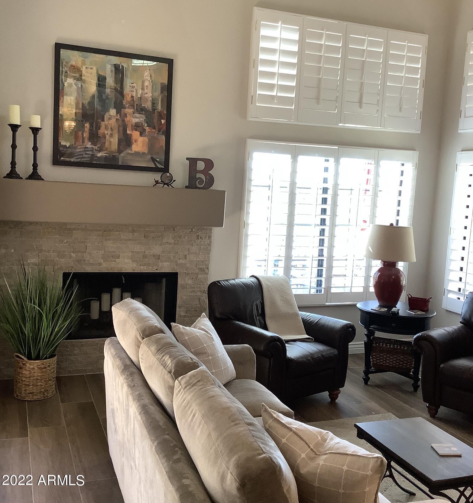 7729 East Joshua Tree Lane Scottsdale, AZ 85250 - Photo 11 of 31 a living room with furniture and a large window