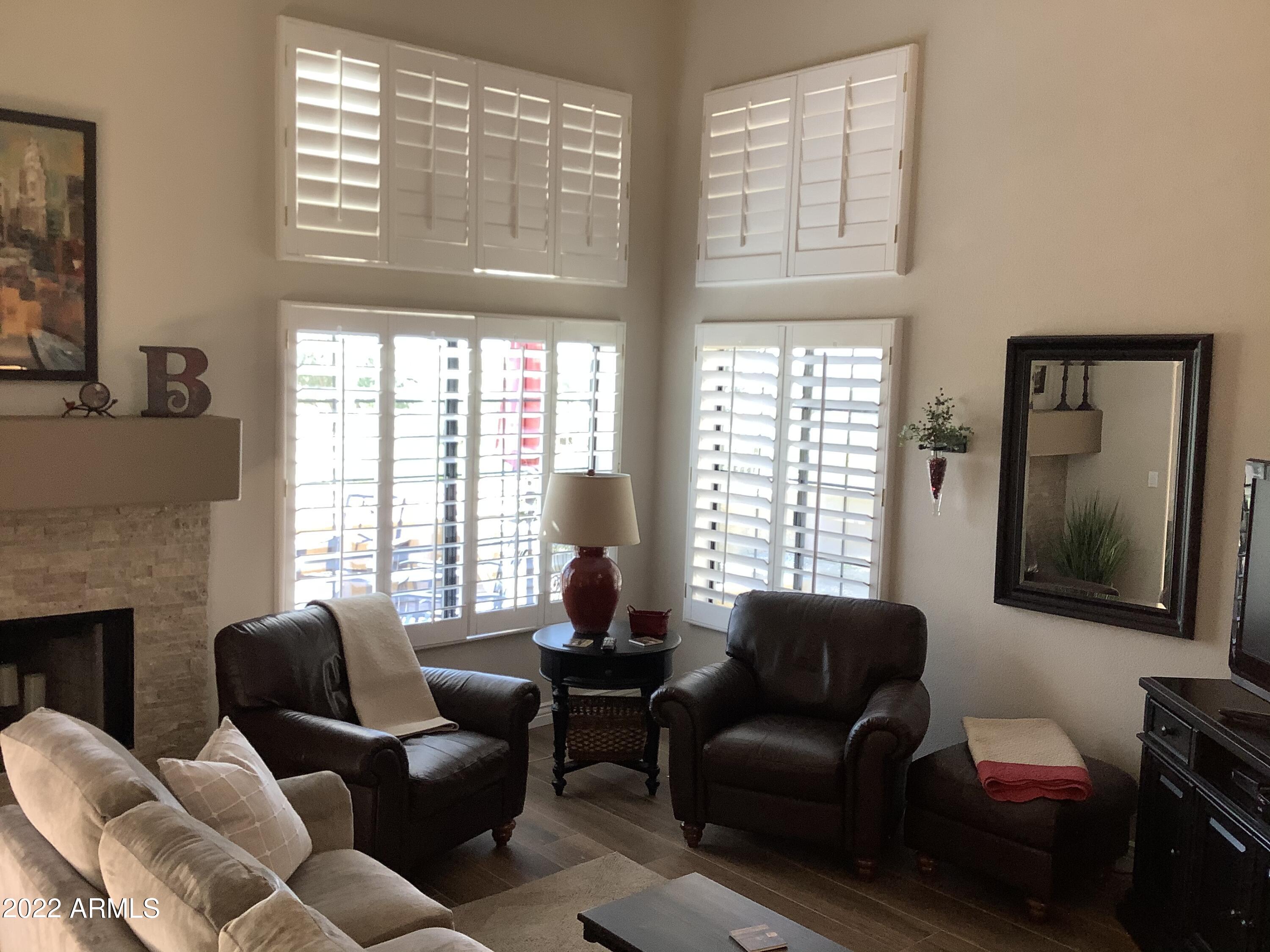 7729 East Joshua Tree Lane Scottsdale, AZ 85250 - Photo 12 of 31 a living room with furniture and a large window
