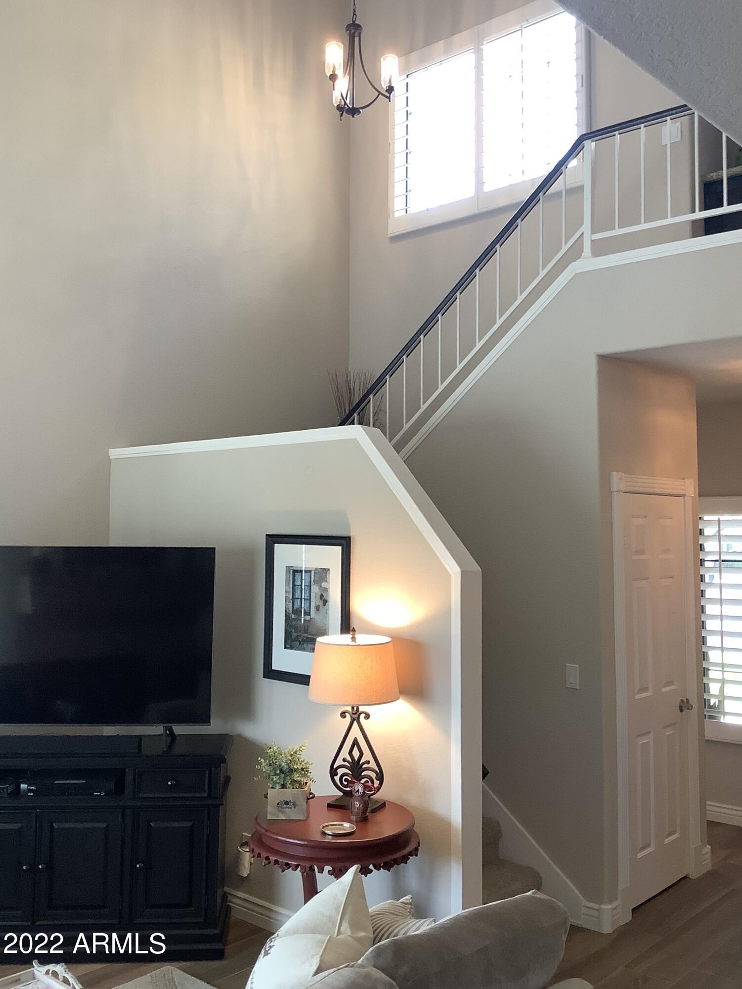 7729 East Joshua Tree Lane Scottsdale, AZ 85250 - Photo 14 of 31 a living room with furniture and a flat screen tv