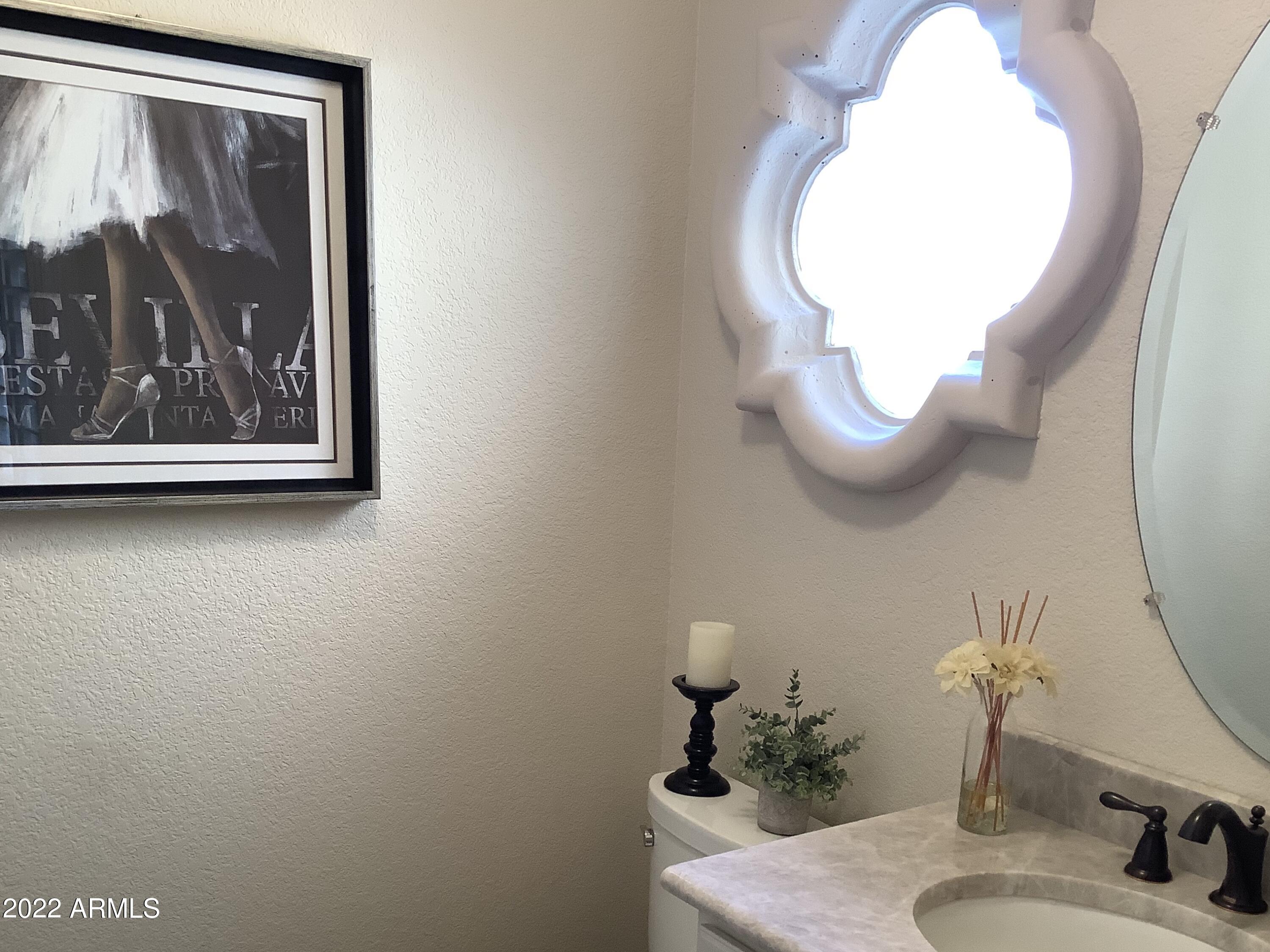7729 East Joshua Tree Lane Scottsdale, AZ 85250 - Photo 15 of 31 a bathroom with a sink mirror and vanity