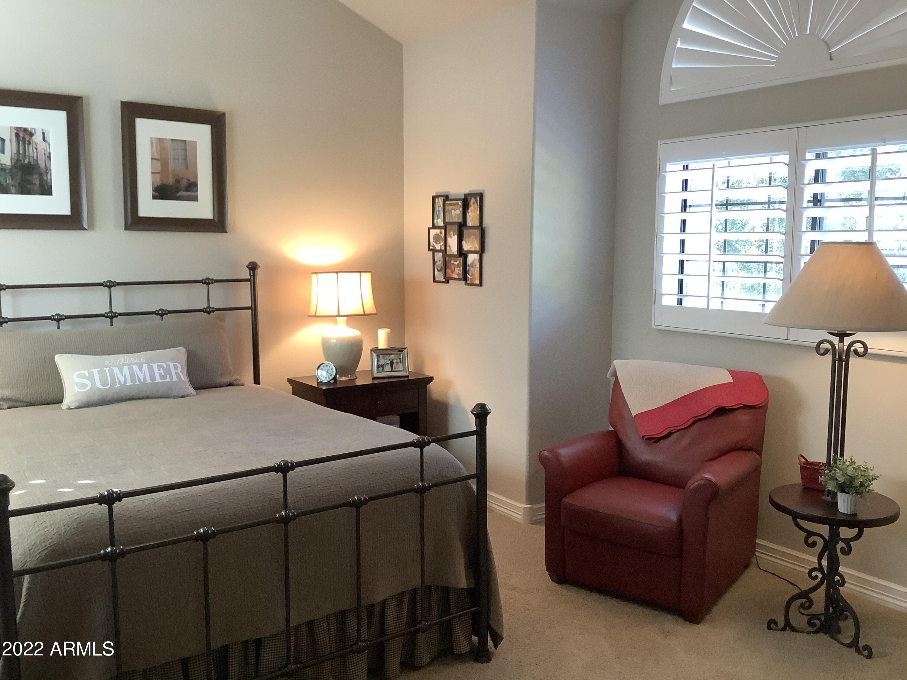 7729 East Joshua Tree Lane Scottsdale, AZ 85250 - Photo 17 of 31 a bedroom with bed and window