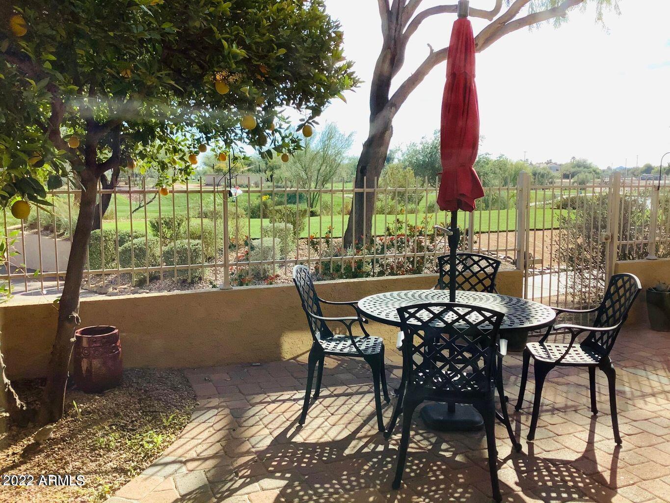 7729 East Joshua Tree Lane Scottsdale, AZ 85250 - Photo 24 of 31 a view of a chairs and table in the patio
