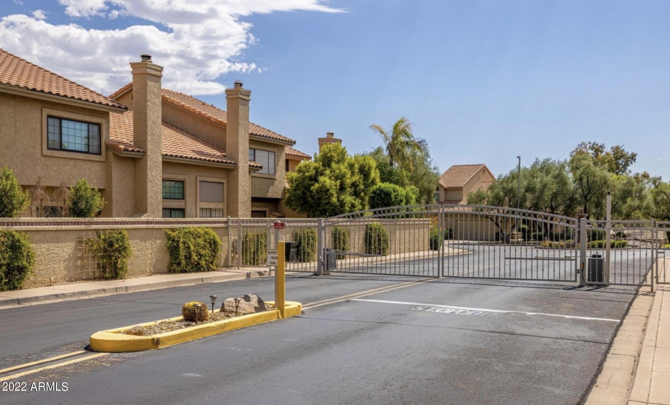 7729 East Joshua Tree Lane Scottsdale, AZ 85250 - Photo 28 of 31 a view of swimming pool with outdoor seating and plants