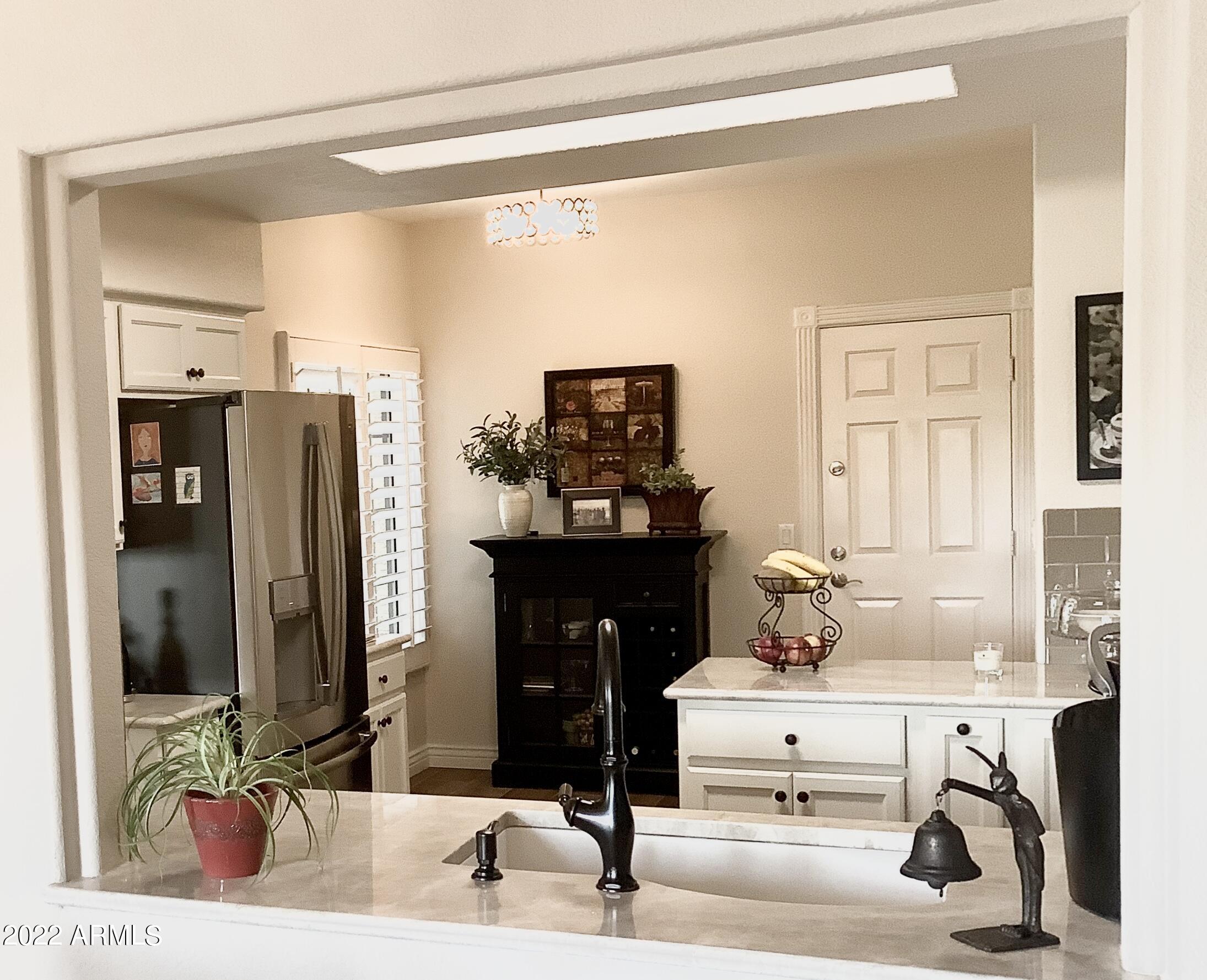 7729 East Joshua Tree Lane Scottsdale, AZ 85250 - Photo 8 of 31 a bathroom with a sink and a mirror